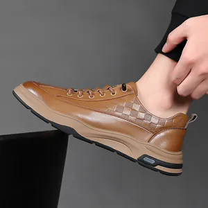 Brown leather sneakers for men with checkered texture and thick soles on feet