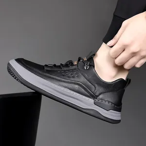 Men's breathable black leather sneakers with grey contrast sole and perforated detail