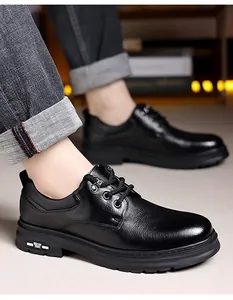 Close-up of black leather casual derby shoes with thick rubber soles and white accents