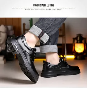 Close-up of black leather oxford shoes featuring non-slip thick rubber soles and laces
