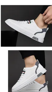Vista de detalle de zapatillas blancas de cuero con textura de diamantes y rayas laterales