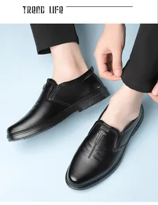 Detailed close-up of premium black leather business loafers with CS logo buckle detail