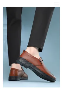 Detail of men's brown leather loafers with textured finish and durable rubber sole