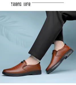 Side view of brown leather slip-on shoes for men featuring elastic side bands and rubber soles