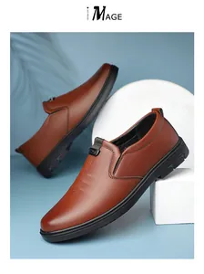 Close-up of brown leather slip-on loafers with side elastic and rubber non-slip sole