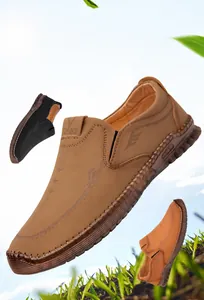 Detailed view of casual men's slip-on shoes with decorative stitching and non-slip rubber soles