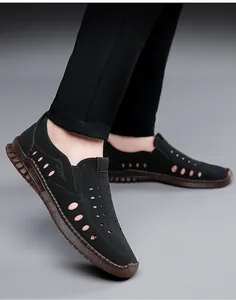 Men's black hollow breathable leather sandals with translucent sole shown on feet