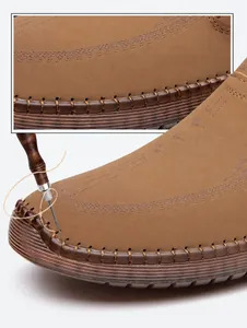 Detail of brown leather casual shoes featuring manual suture and anti-slip rubber sole