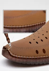 Detail view of manual stitching on brown leather sandals for enhanced durability