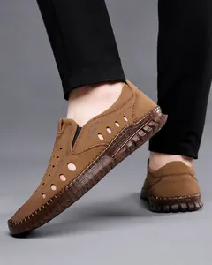 Detailed view of men's brown hollowed leather sandals with non-slip gum rubber sole