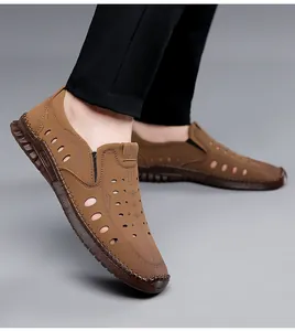 Detailed side view of brown leather men's hollow sandals with sport logo and hand stitching