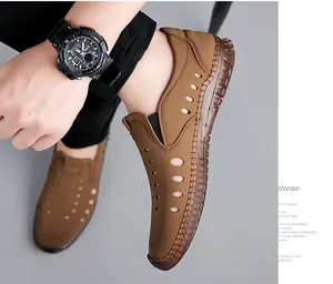 Detail of men's hollow out brown leather sandals with breathable holes and hand stitching