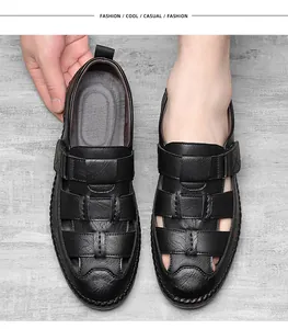 Close-up of men's black leather breathable sandals with velcro strap and hollow out design