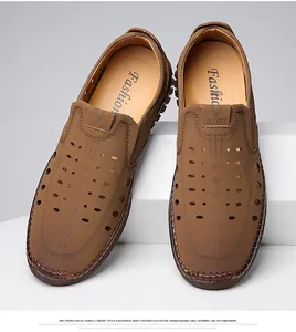 Detail of brown hollow-out men's leather loafers with breathable holes and hand-stitched edges