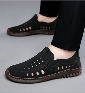 Detail view of men's hollow leather sandals showing breathable holes and non-slip sole