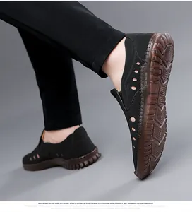 Detail of men's leather hollow sandals with breathable side cuts and non-slip gum sole