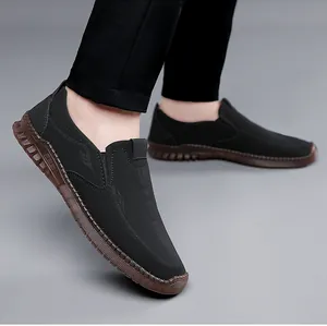 Detail of casual men's loafers with contrast stitching and durable rubber sole
