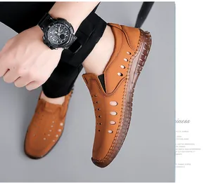 Detail of brown leather men's sandals with breathable cut-outs and contrast stitching
