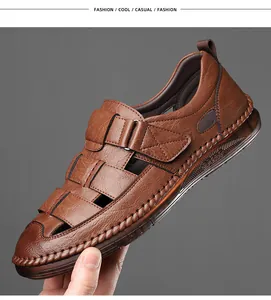 Detailed view of hand-stitched leather texture and hook-and-loop strap on brown sandals