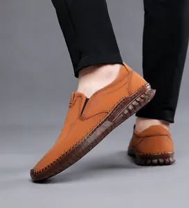 Detailed side view of brown slip-on casual shoes with non-slip durable rubber sole