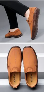 Macro detail of men's brown leather slip-on loafers with sport logo and stitching
