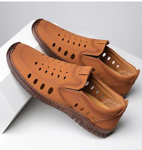 Detail view of brown leather sandals with breathable cutouts and hand-stitched sole
