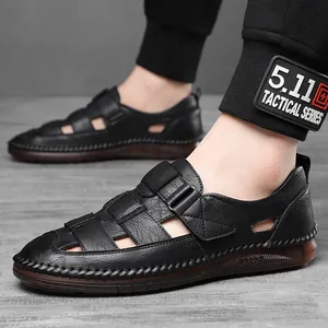 Men's closed-toe leather sandals with hollow cut-outs and soft brown rubber soles