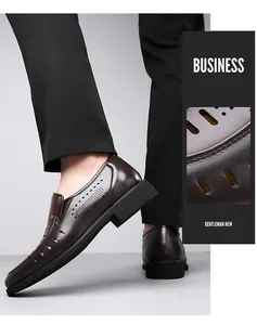 Detail view of dark brown leather dress shoe with hollow breathable holes and rubber sole