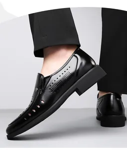 Close-up of black breathable hollowed leather loafers for men in business casual style