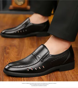 Close-up of black breathable leather dress shoes with hollow-out design for men