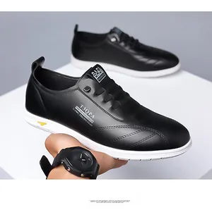 Close-up of black leather loafers with white stitching and T3QPA side lettering