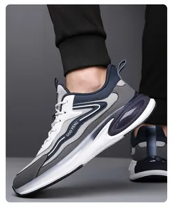 Detail showing white and blue leather mesh panels with GUO FENG text on men's running shoes