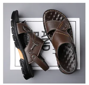 Detail of dark brown leather sandals showing lychee grain texture and dual-use heel strap
