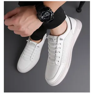 Detail view of white breathable sneakers with side perforations and thick gray soles