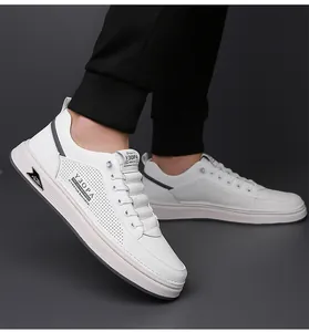 Detailed close-up of white breathable sneakers with side perforations on feet