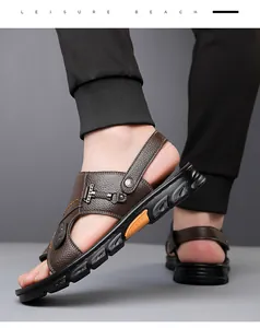 Close-up of brown leather men's sandals with fine stitching and anti-slip sole details