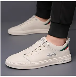 Detail of white leather men's sneakers featuring green and red stripes on the heel