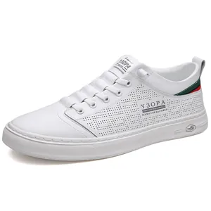 White men's leather casual sneakers with laser-cut perforations and striped heel detail
