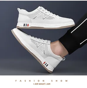 Detail of white hollowed breathable casual sneakers with colorful sole accents and laces