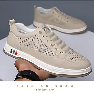 Detail shot of men's cream casual sneakers with breathable perforated side panels