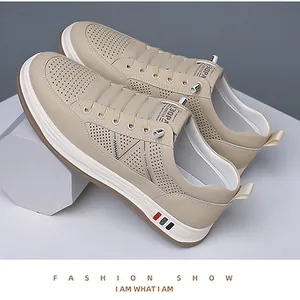 Macro detail of breathable perforated leather and Y3OPA branding on beige sneakers