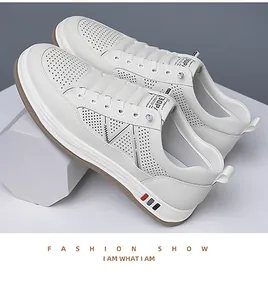 Close-up of breathable perforated white leather sneaker with anti-slip brown rubber sole