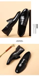 Macro detail of black leather loafers showing a sleek metal buckle and polished finish