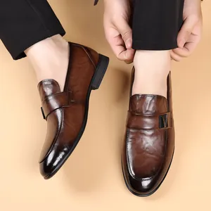 Men's brown gradient leather loafers featuring a flat rubber sole and a slip-on design