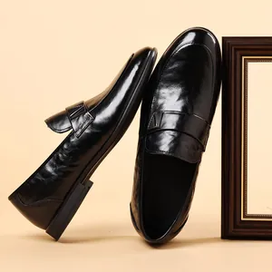 Formal black leather loafers for men with polished finish and stylish cross strap design
