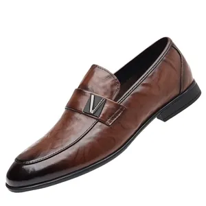 Classic dark brown leather loafers with metallic V-buckle accent and rubber sole