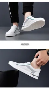 Detailed close-up of white breathable mesh panel and rubber anti-slip sole on men's sneaker