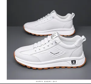 Detail of white men's sneakers with thickened sole, non-slip rubber base and brand logos