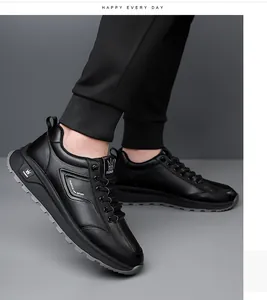 Detailed side view of black leather casual sneakers with non-slip serrated outsoles