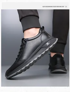Detailed side view of black casual leather shoes with breathable perforated design